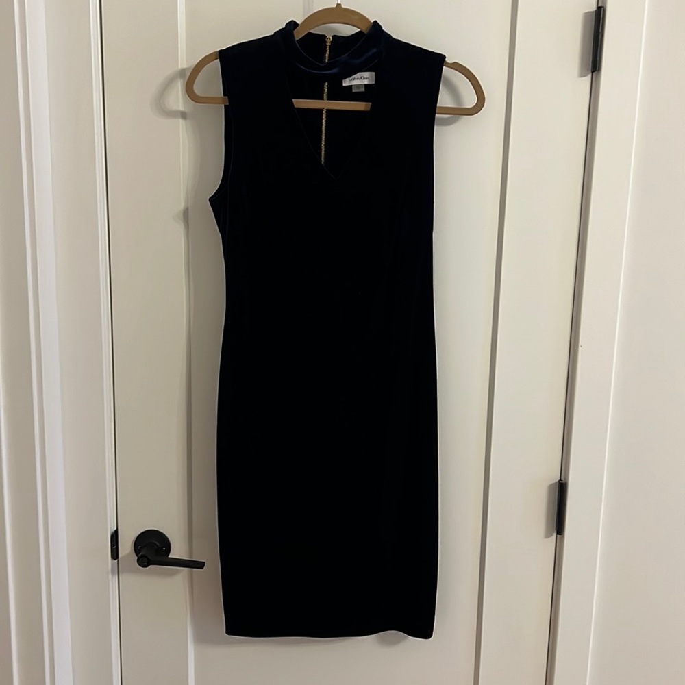 Velvet blue cocktail dress with exposed zipper in back.